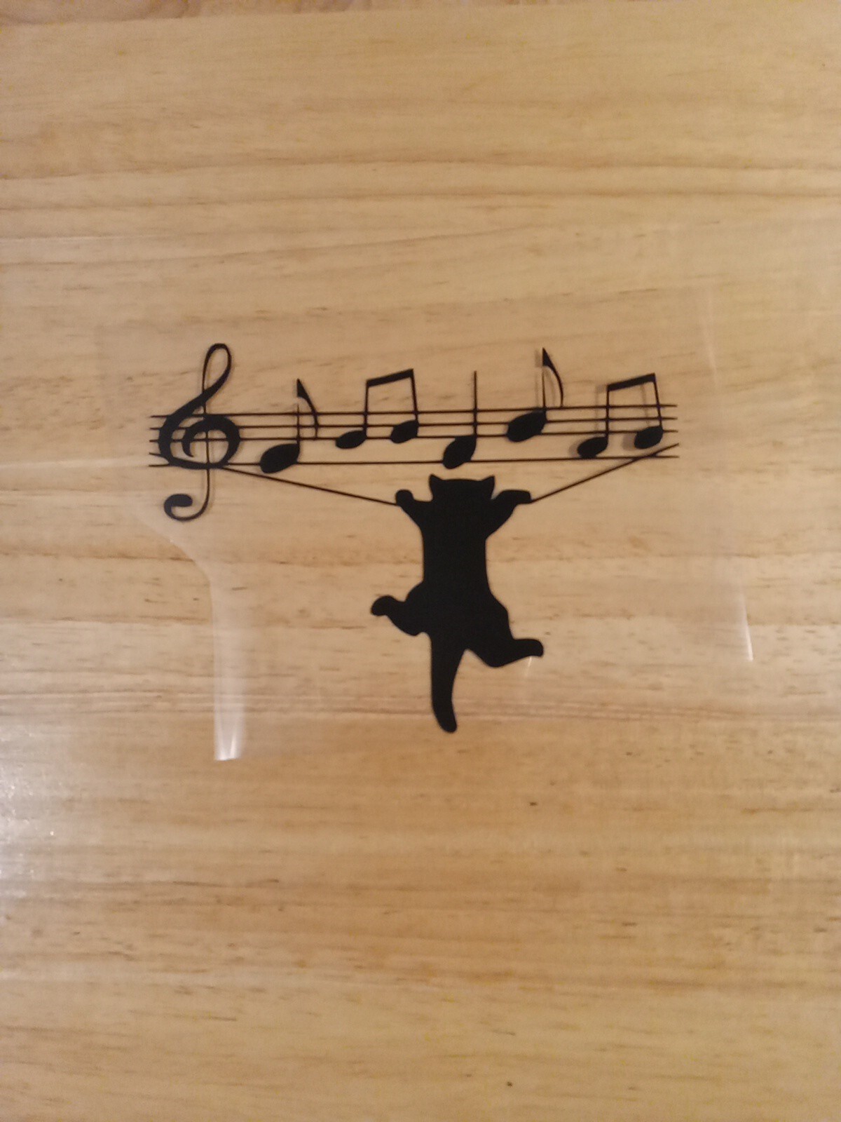 Cat Hanging Music Notes Decal