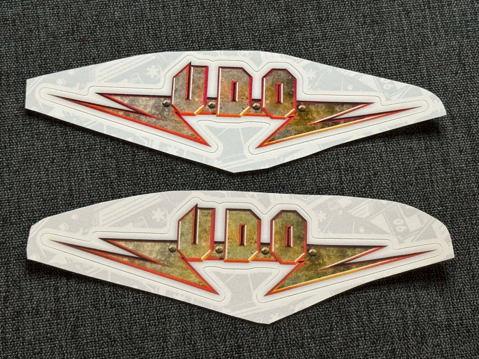 Lot (2) U.D.O. 1 1/4″ x 5″ Band Logo STICKERS Gold Red FAST! FREE SHIP! UDO
