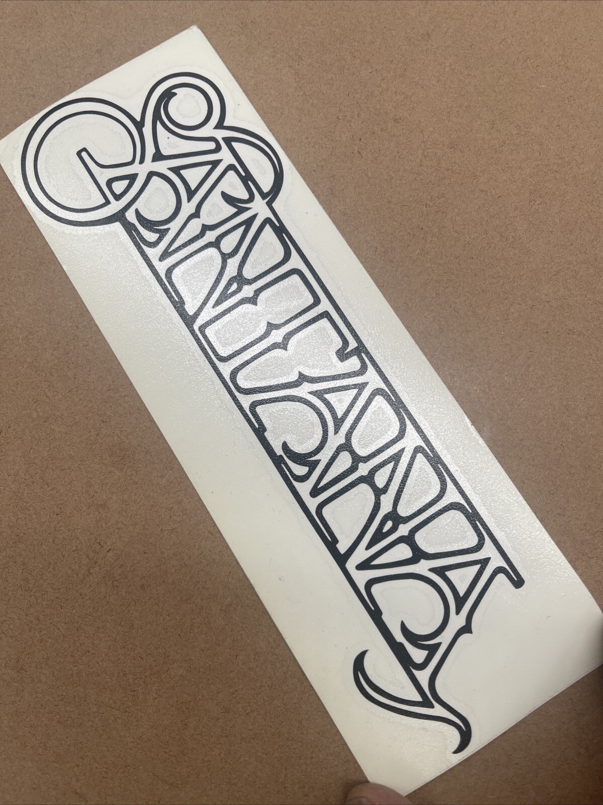 Carlos Santana Logo Black Vinyl Decal: 8 1/4” X 2 3/4”, Not For Porous Surfaces