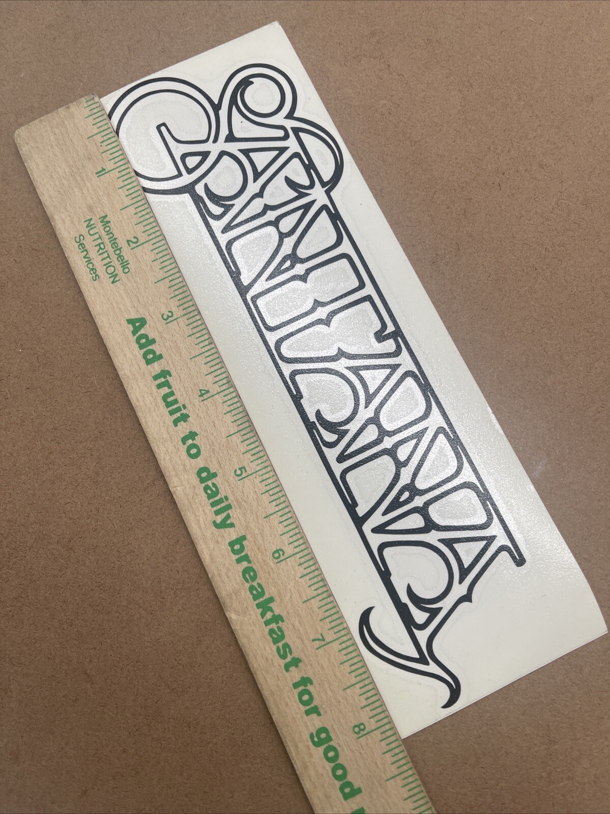Carlos Santana Logo Black Vinyl Decal: 8 1/4” X 2 3/4”, Not For Porous Surfaces