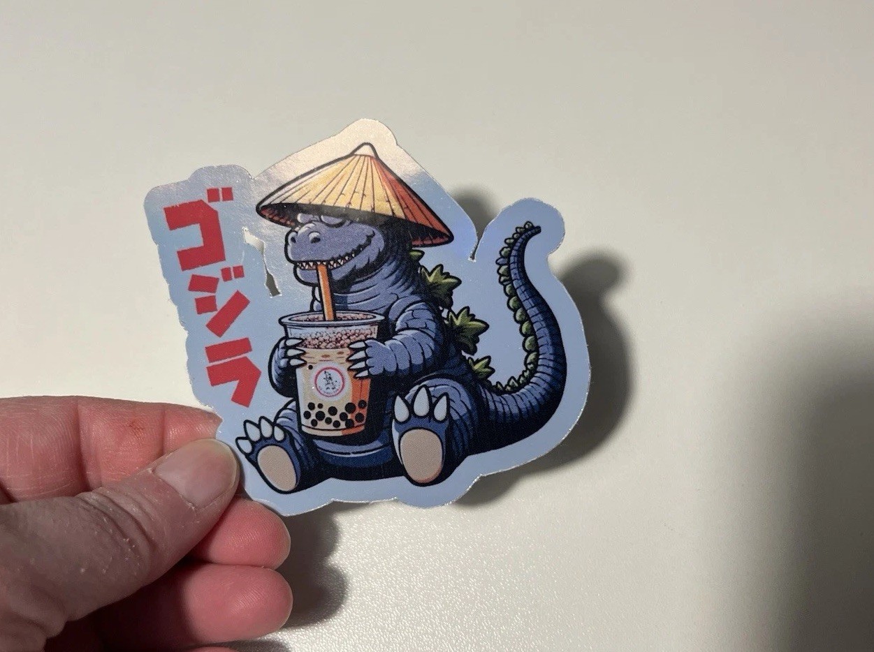 Godzilla drinking a boba tea 3 Inch Waterproof Vinyl Holographic Sticker