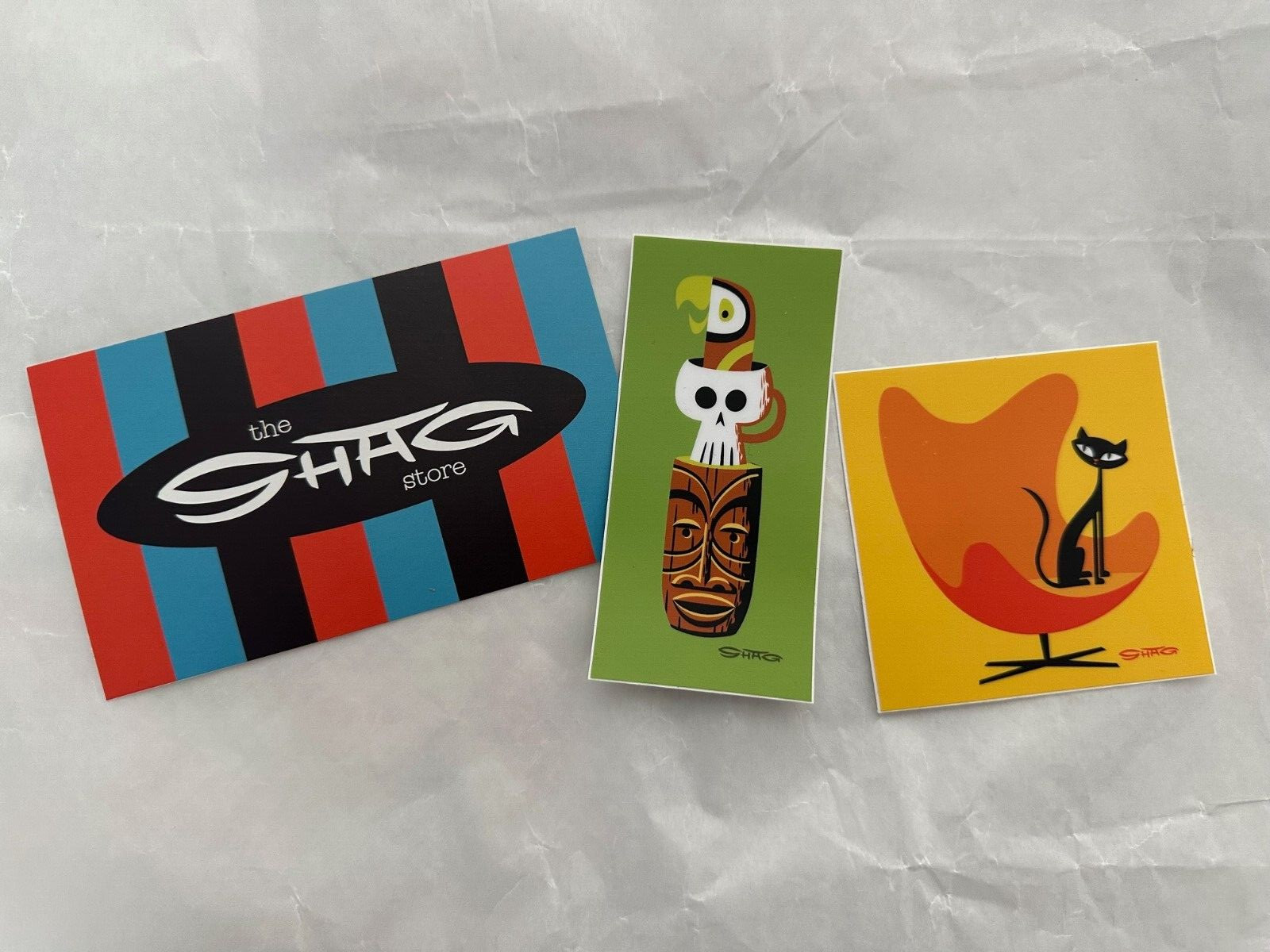 Shag Josh Agle Sticker Slaps Decal Black Cat and Tiki Mask, Parrot and Skull mug