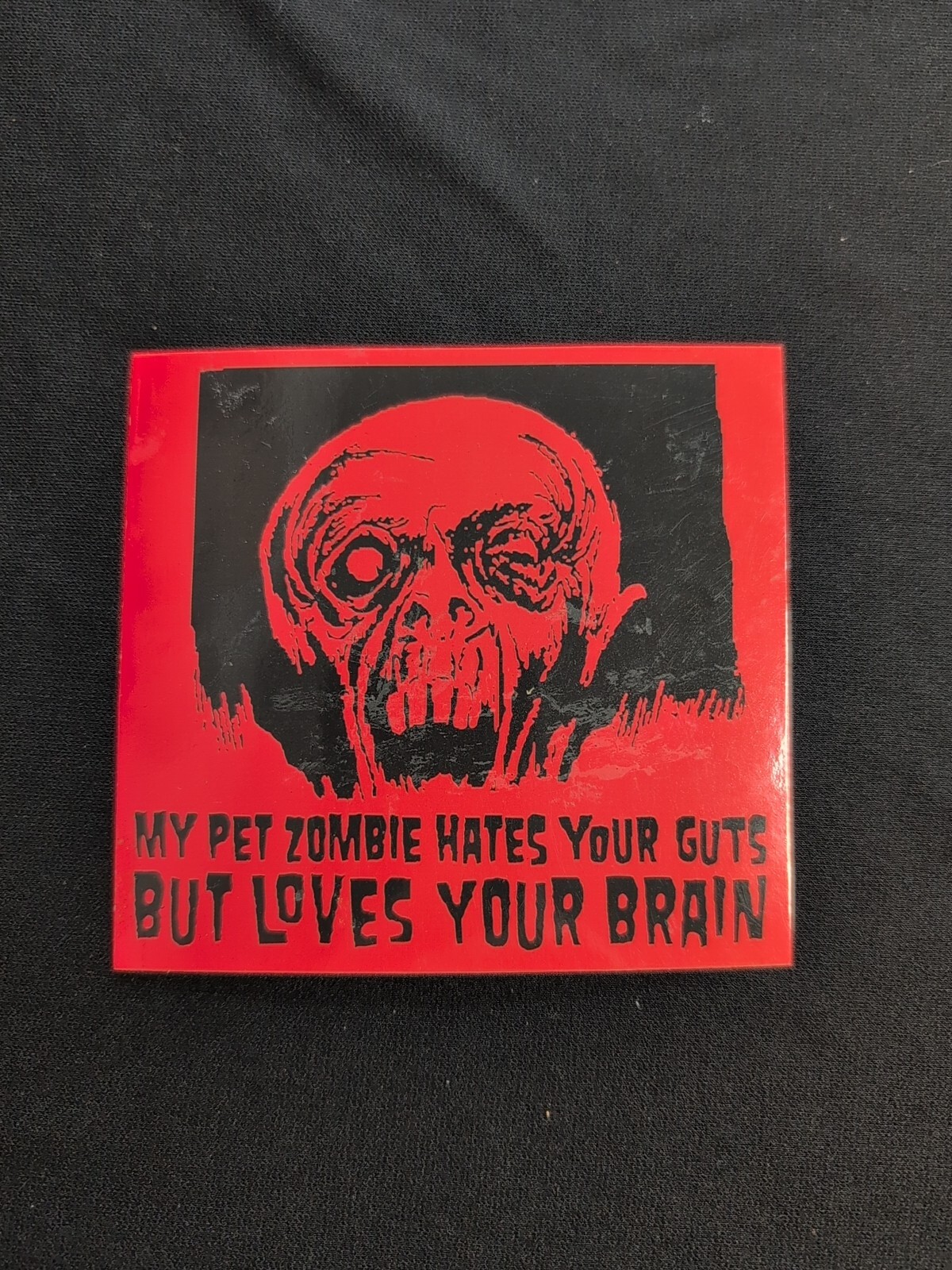 My Pet Zombie Hates Your Guts Loves Your Brain Bumper Sticker Vinyl Decal 4″x 4″